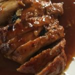 Pork tenderloin roast in white plate