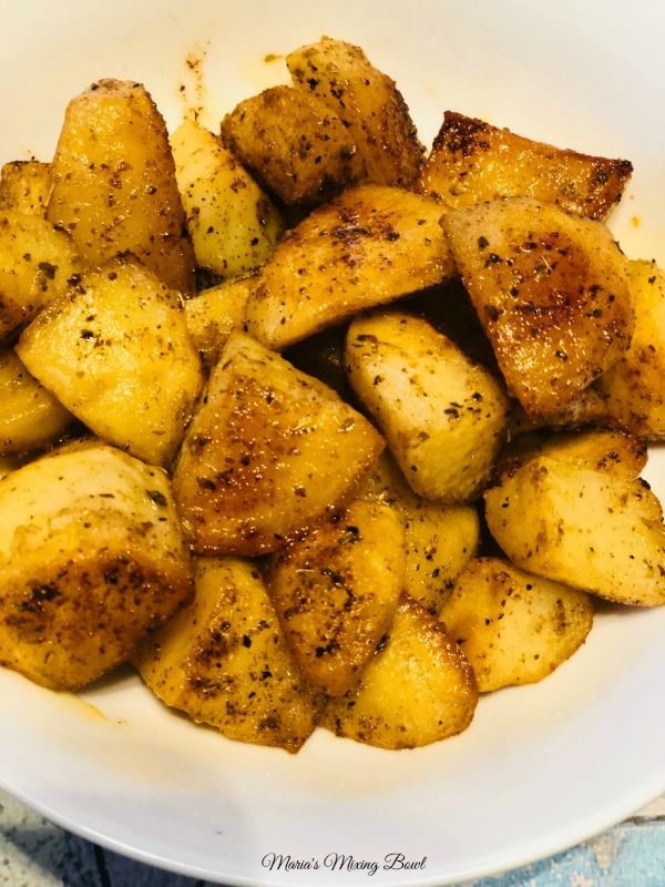 seasoned potatoes in a bowl on table 