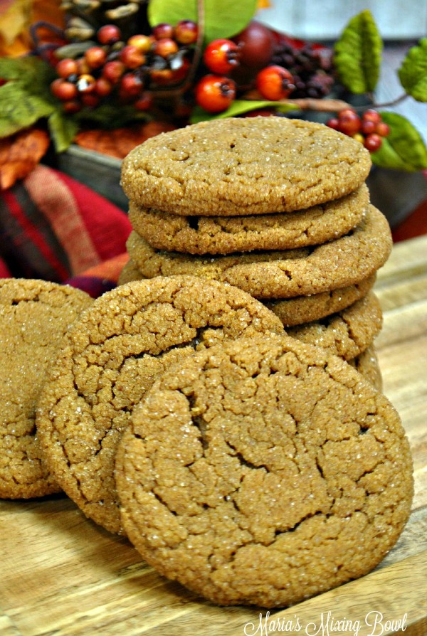 cookies on a board with a red napkin and cranberry decor