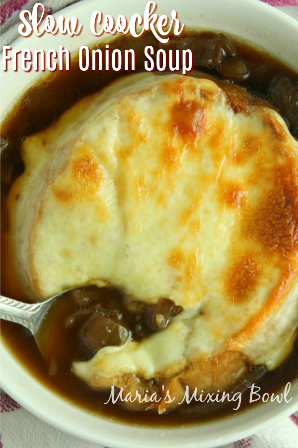 Slow Cooker French Onion Soup Slow cooker French onion soup in white bolw with spoon
