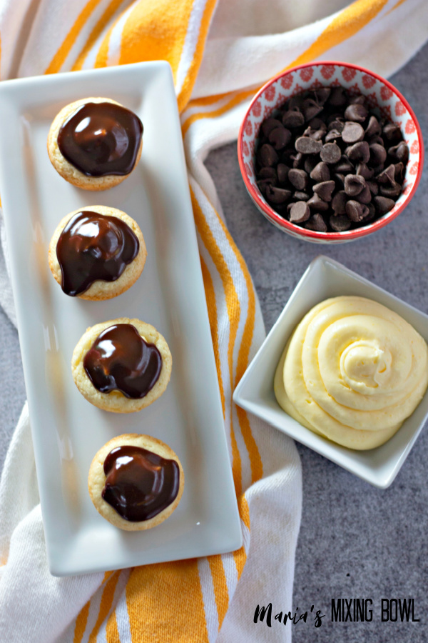 dessert cups in a white platter cream and chocolate chips sert cups with