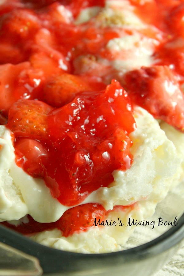 layers of angel food cake and berries stacked on top of each other