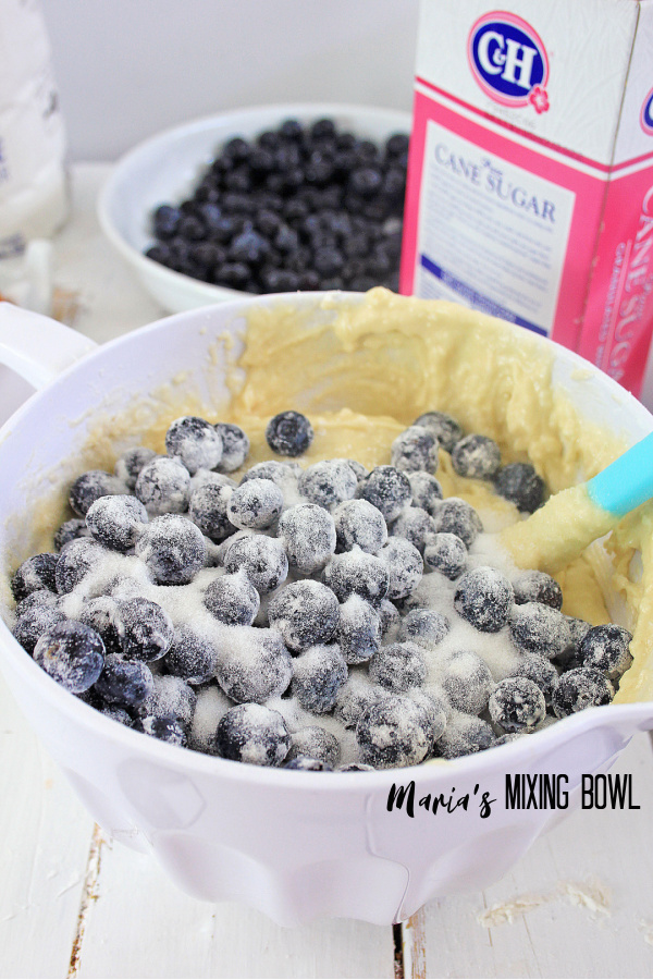 Blueberry Muffin Cake ingredients mixed in a white bowl