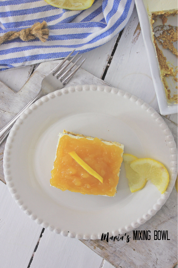 Lemon Icebox Cake with lemon slice on white plate