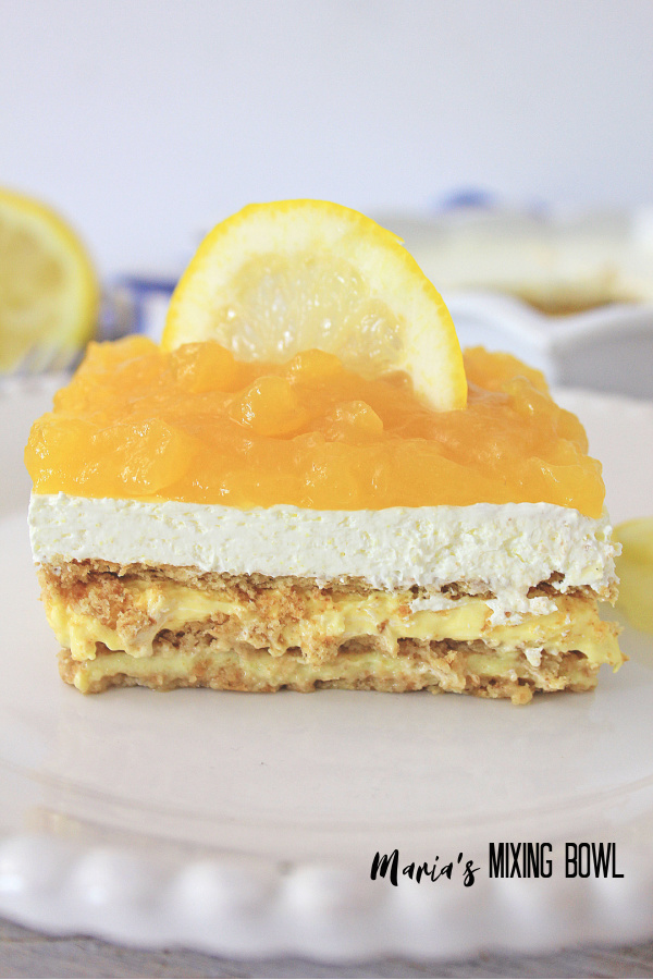 Lemon Icebox Cake with lemon slice on white plate