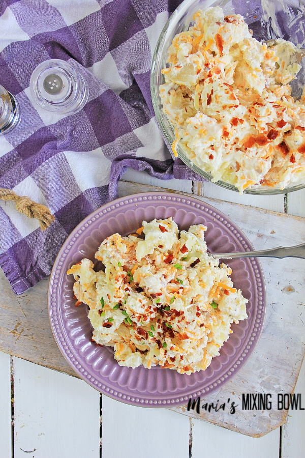 Loaded Potato Salad ready to serve on plate and bowl