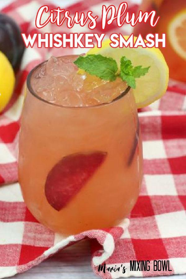 Citrus Plum Whiskey Smash on a red and white plaid napkin
