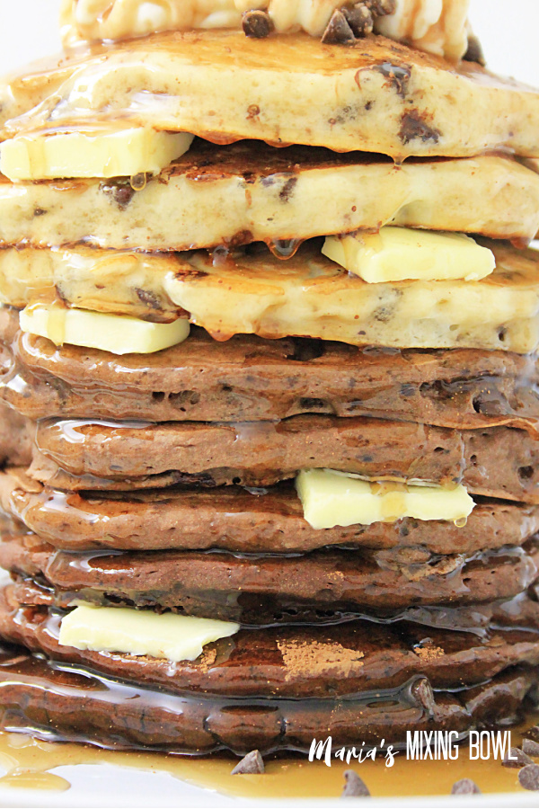 Stack of chocolate pancakes with butter pats in between