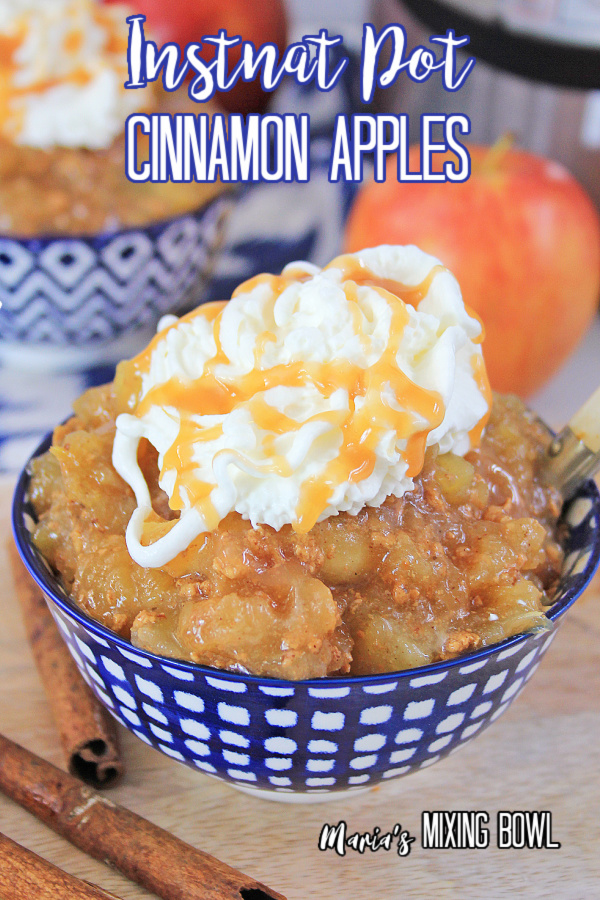cinnamon apples in a blue and white bowl topped with whipped cream with apples 