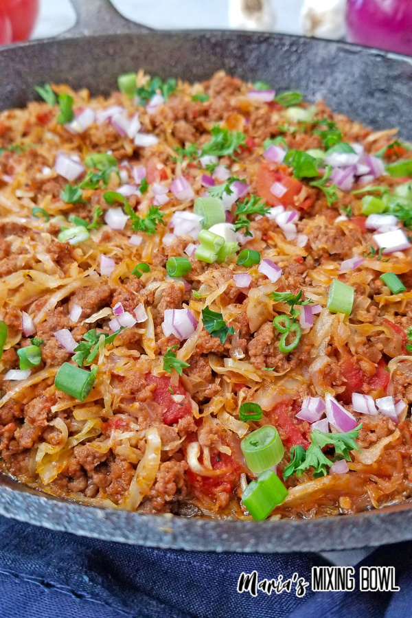 beef and cabbage cooked with scallion and chopped red onion
