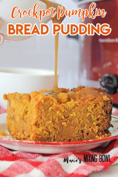 crockpot pumpkin bread pudding dessert with caramel sauce pored over it. white and red checked napkin and red crockpot