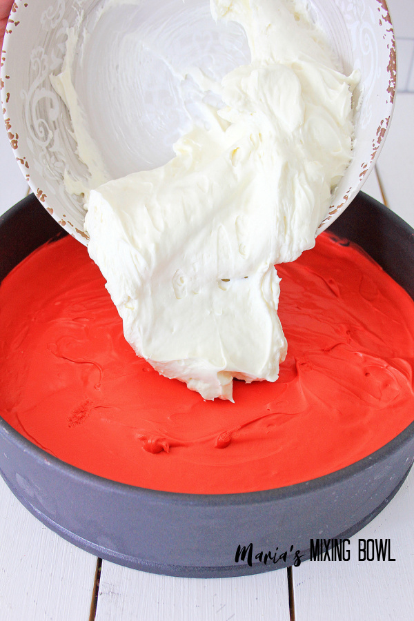 white cream cheese layer poured on top of red layer