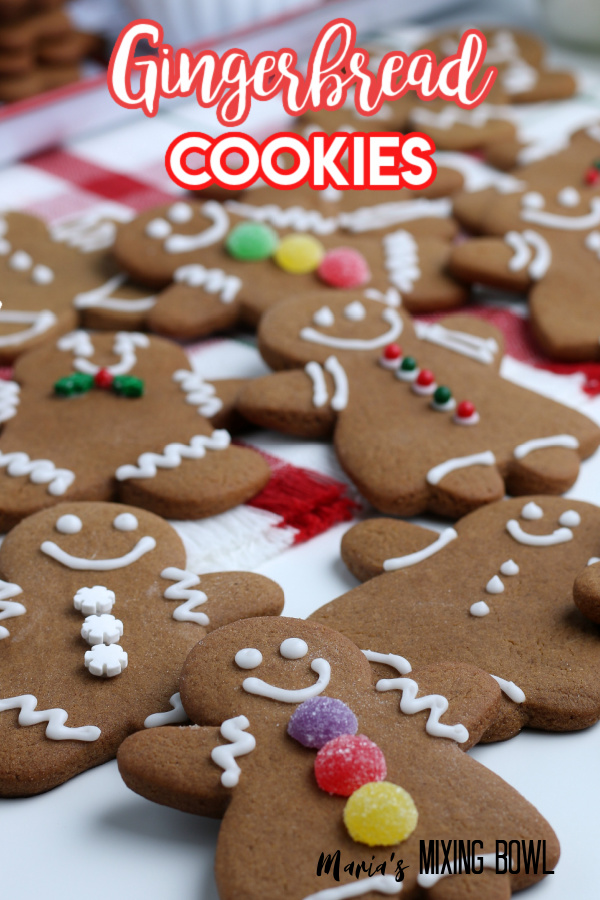 cookies shaped like gingerbread people and decorated