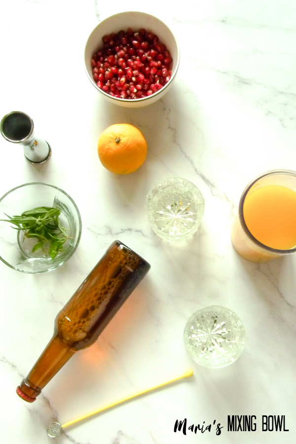 ingredients for holiday drink on a marble table