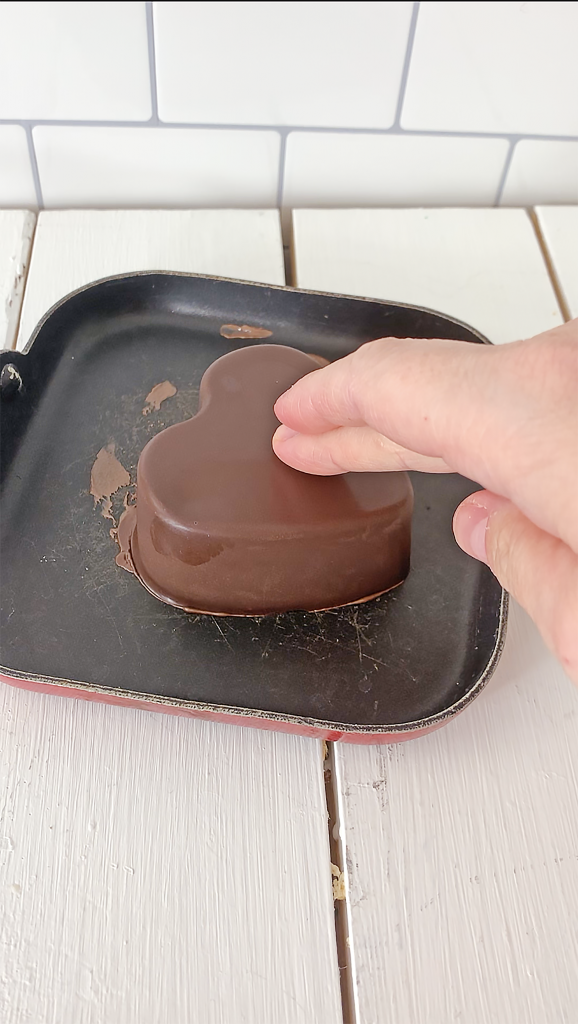 half chocolate heart on a warm pan