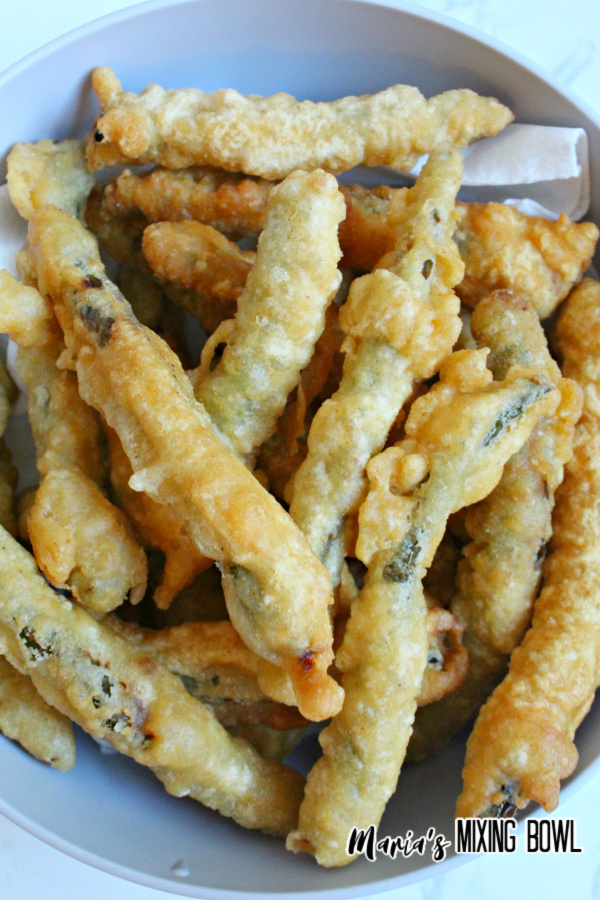 battered green bean in white bowl