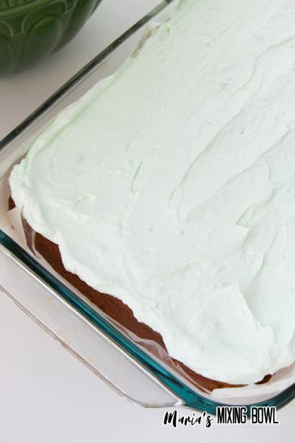 Pudding layer over cake in glass baking dish.