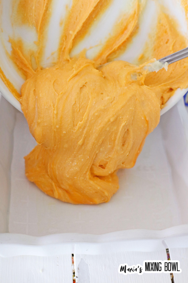 Fudge batter being poured into baking dish
