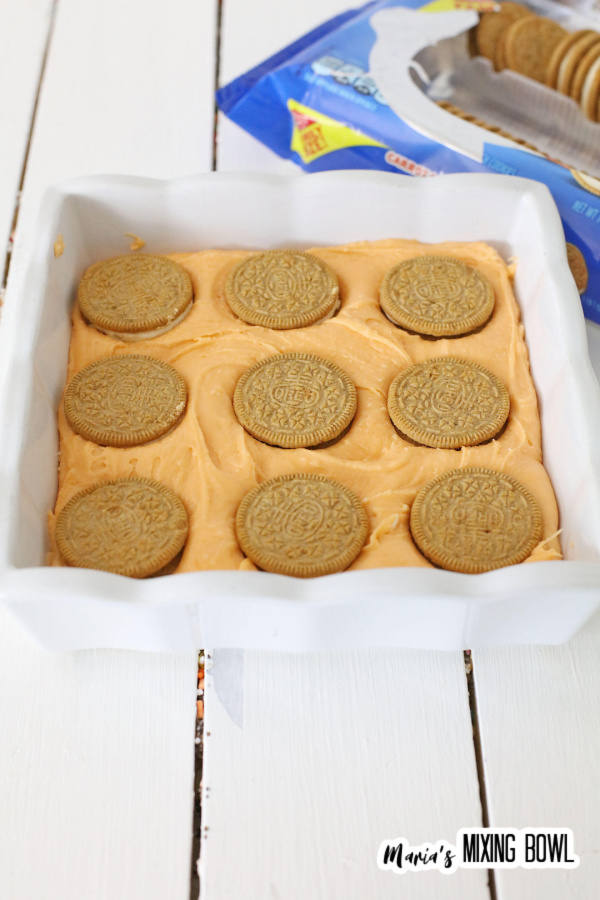 Baking dish with layer of fudge batter topped with Oroe cookies
