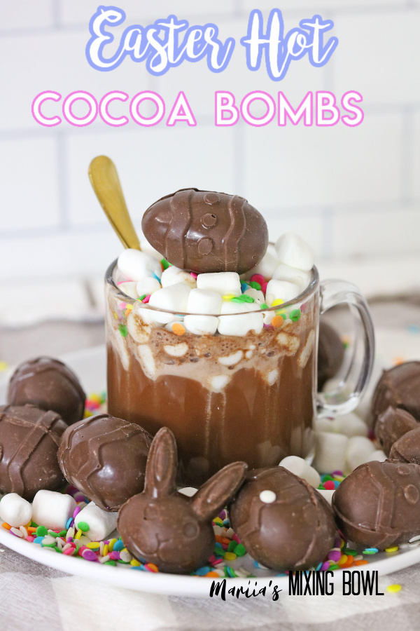 Easter hot cocoa bombs surrounding mug of hot cocoa with bomb on top