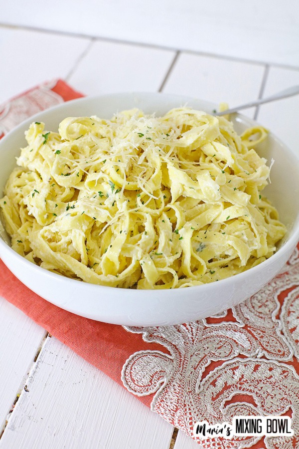 pasta in a white bowl on an orange napkin