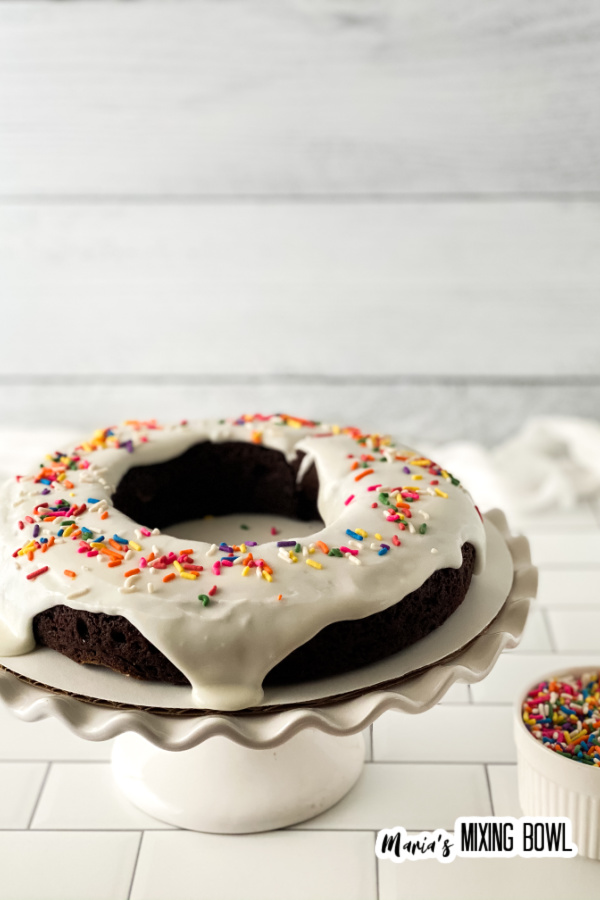 cake on white plate with white frosting