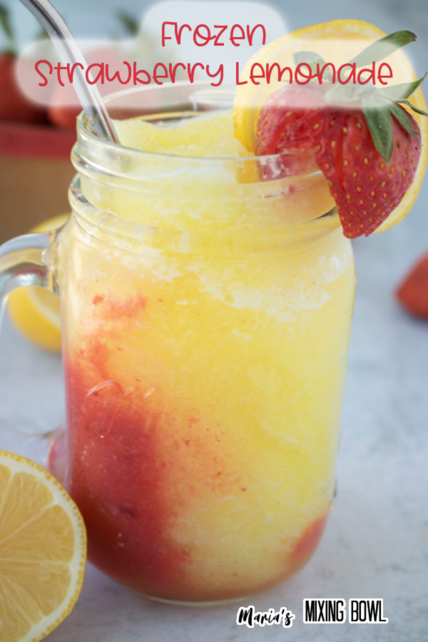 Frozen strawberry lemonade in mason jar glass garnished with lemon and strawberry