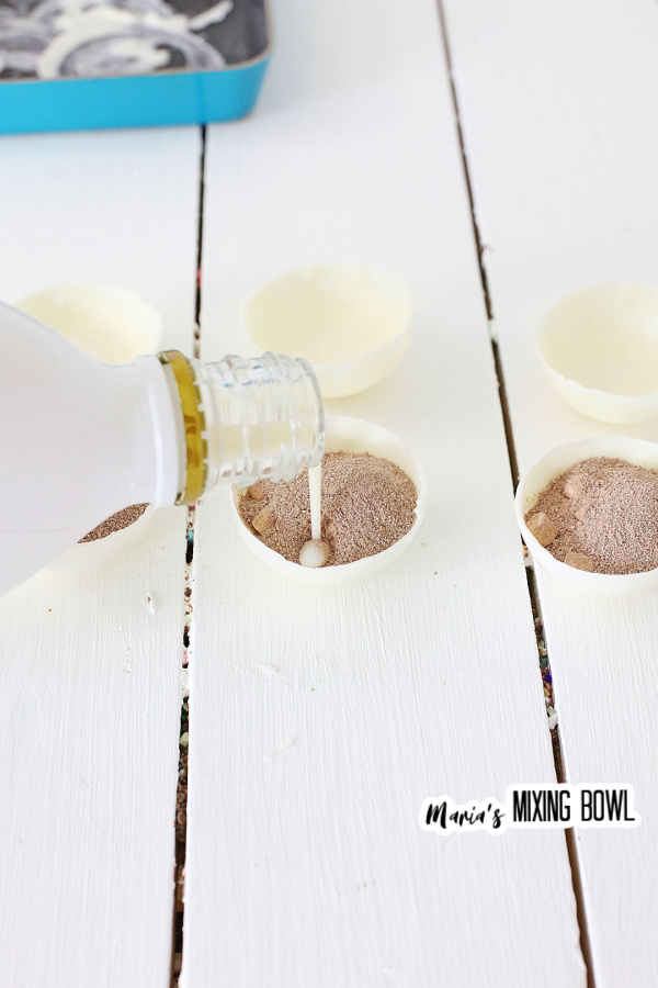 Rumchata poured in hot cocoa bombs