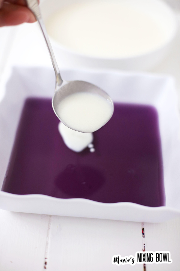 Layering white gelatin over purple jello