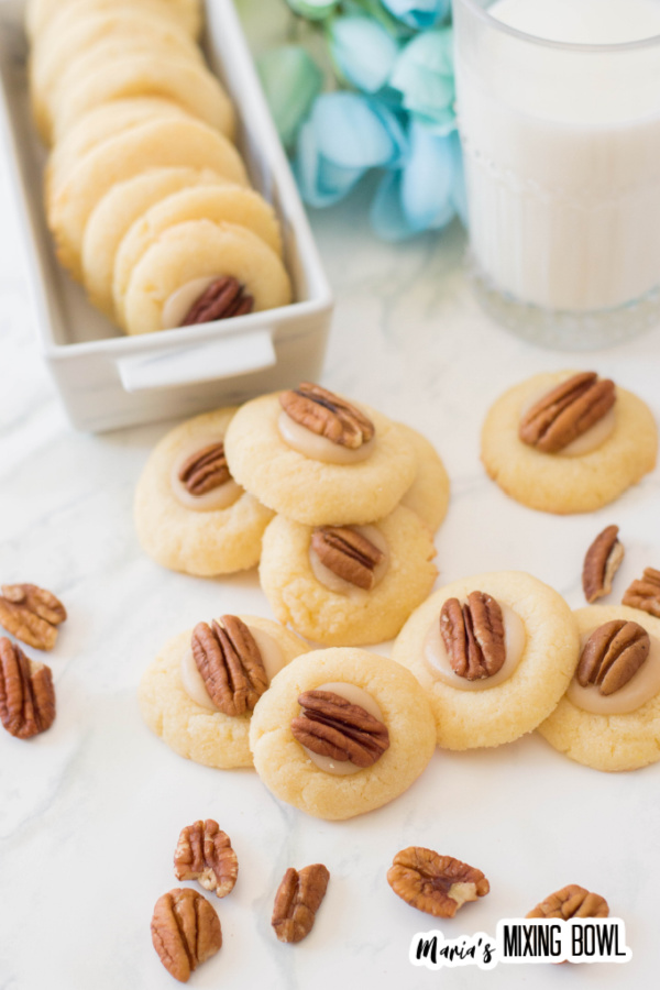 Thumbprint cookies with pecan on white table