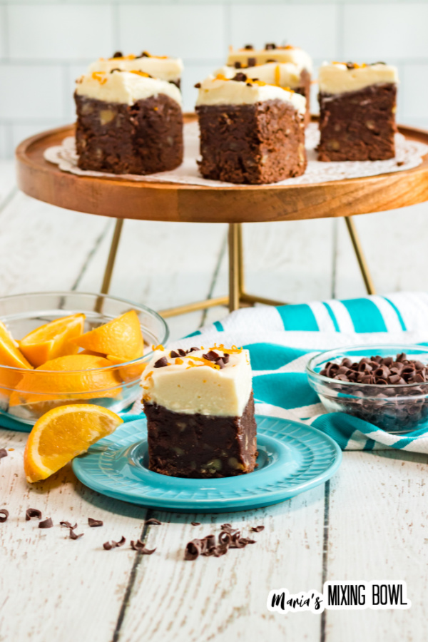 brownies on a blue plate and cake stand