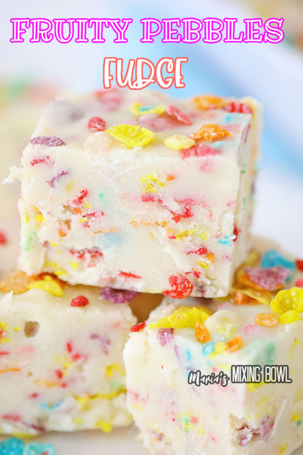 Closeup shot of squares of Fruity Pebbles fudge stacked atop one another