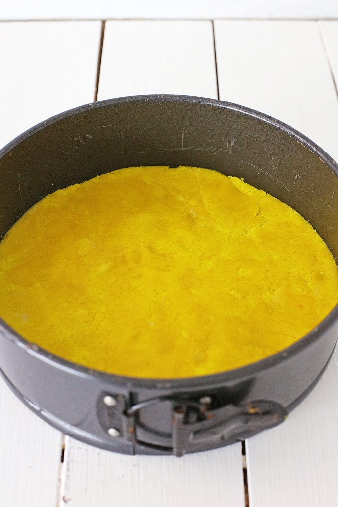 Cooked base of cake in springform pan