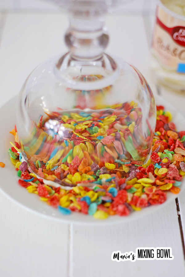 Glass turned upside down and dipped in Fruity Pebbles