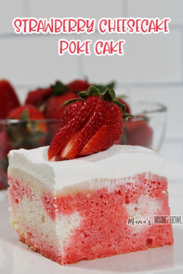 Closeup shot of slice of strawberry cheesecake popke cake topped with strawberry