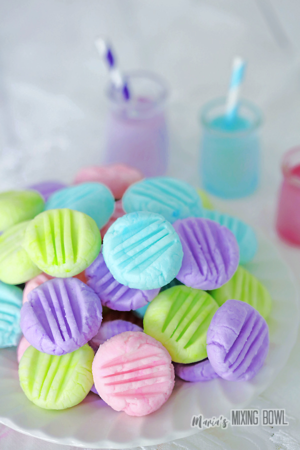 Crem cheese mints stacked atop one another on plate