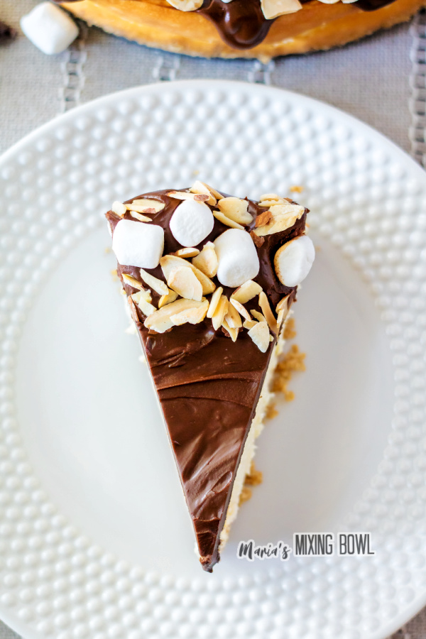 Closeup overhead shot of rocky road cheesecake on white plate