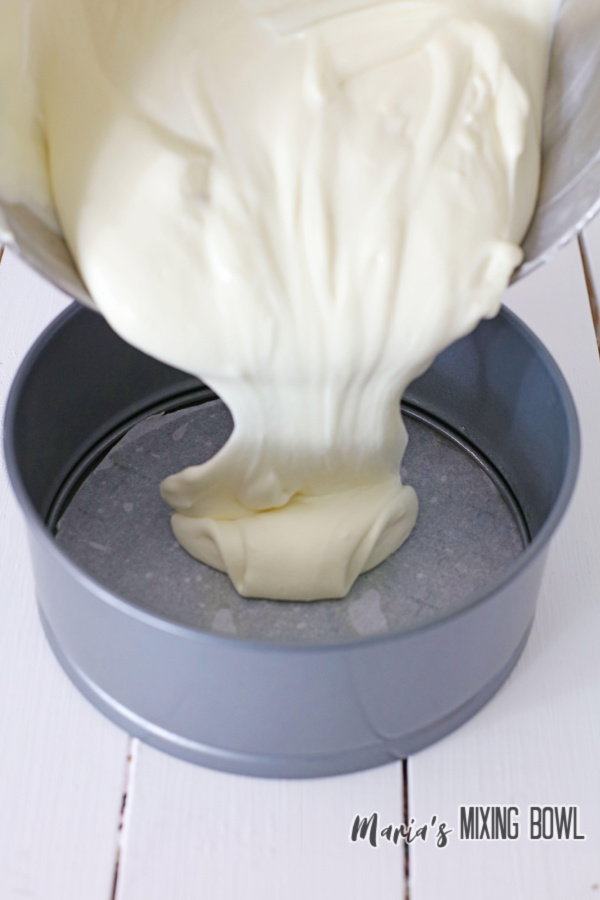 Pouring cheesecake batter into springform pan