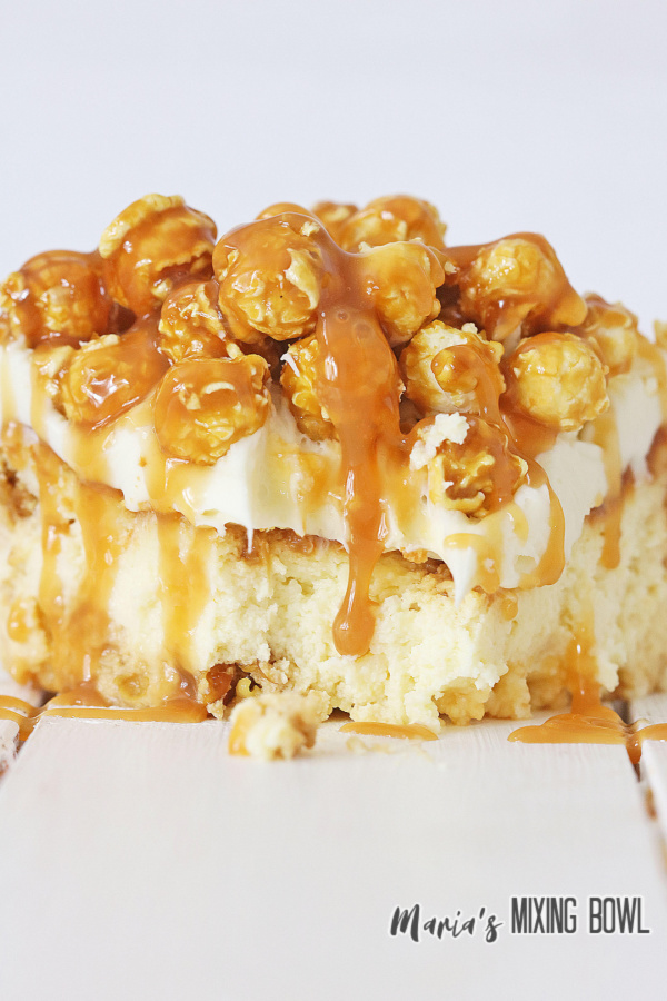 Closeup shot of slice of caramel corn cheesecake.