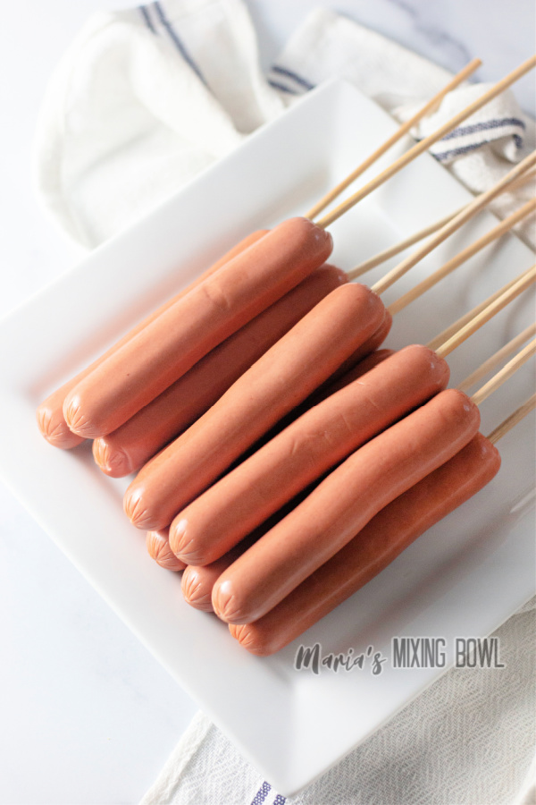 Hot dogs on wooden skewers