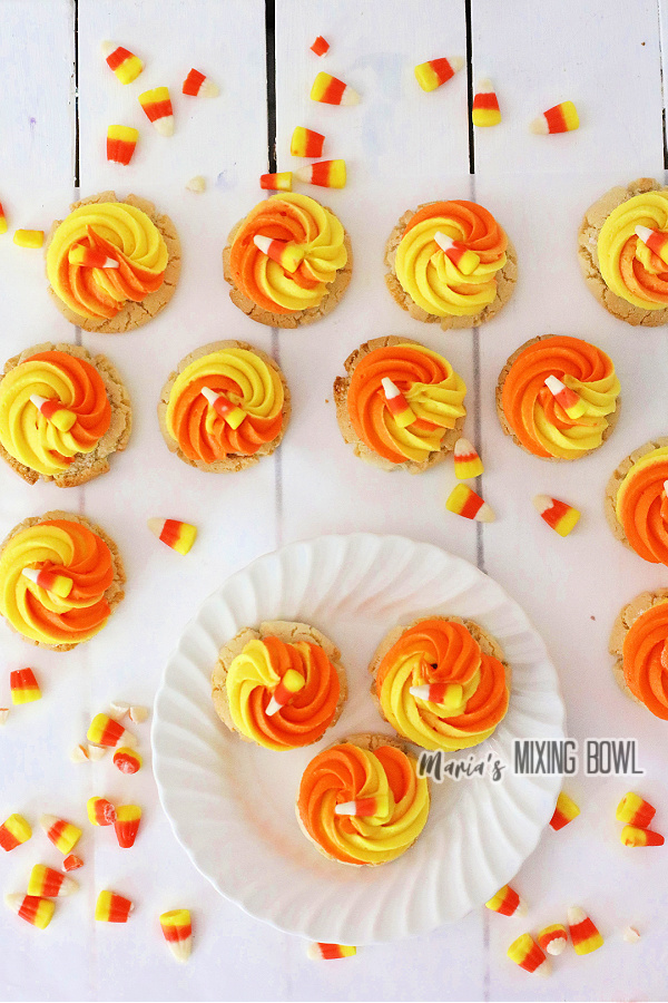 Overhead shot of yellow and orange frosted cookies