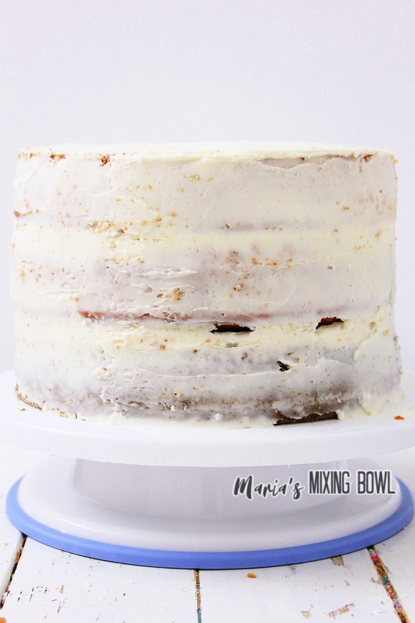 Frosted pumpkin spice latte cake on cake stand