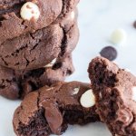 triple chocolate cookies on white board with chips