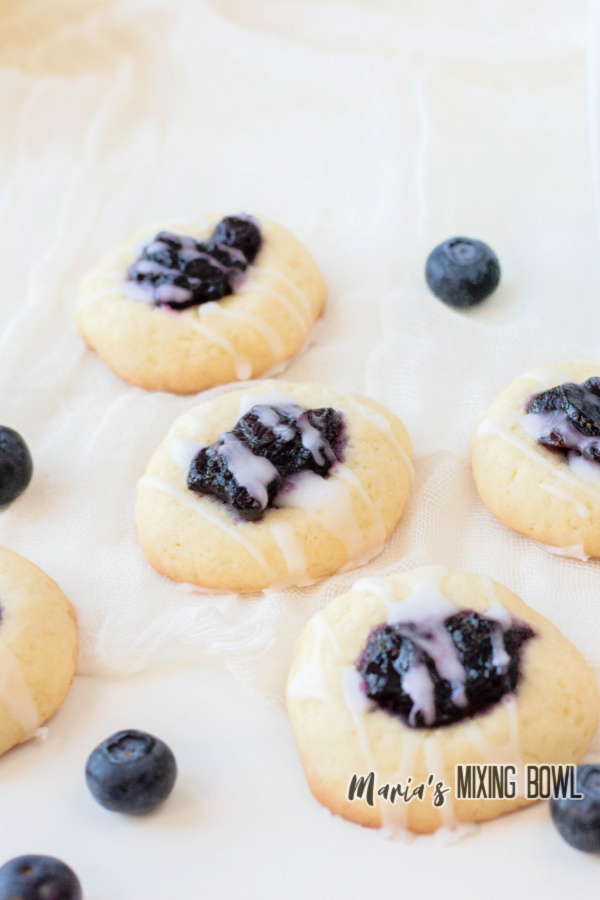 blueberry thumbprint cookies with glaze and blueberries