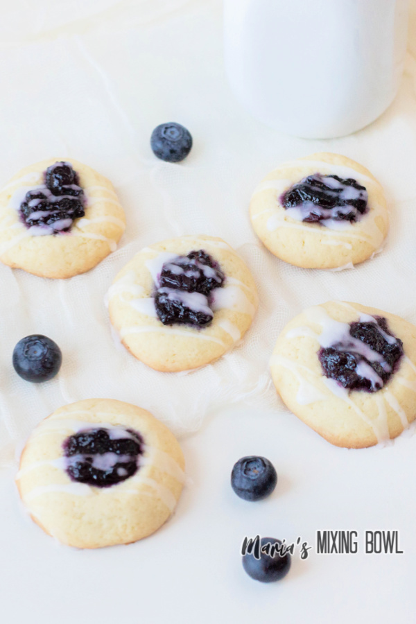 blueberry thumbprint cookies with blueberries and glaze