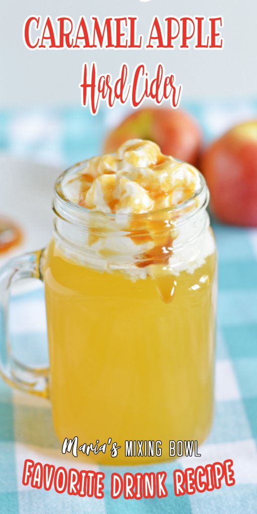 Closeup of caramel apple hard cider topped with whipped cream and caramel sauce.