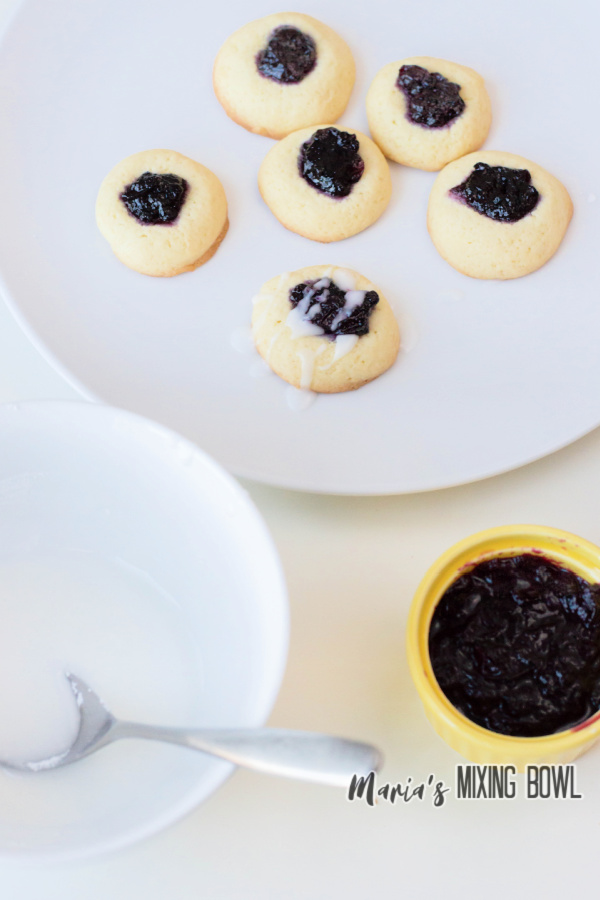 cookies on white plate with jam