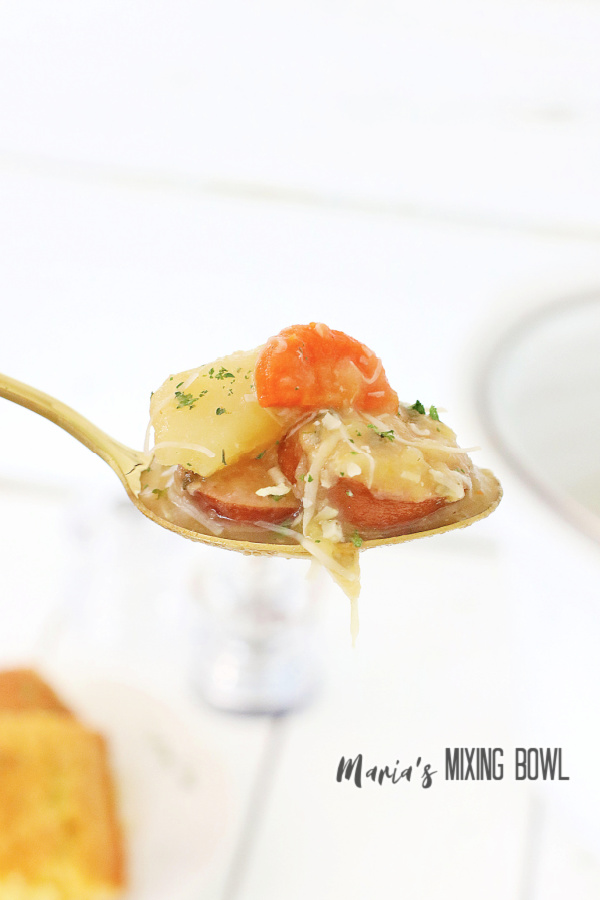 Closeup shot of spoonful of kielbasa potato soup