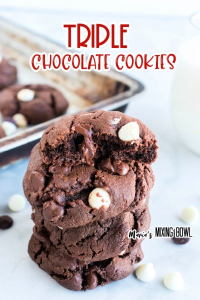 cookies stacked, cookie sheet in background