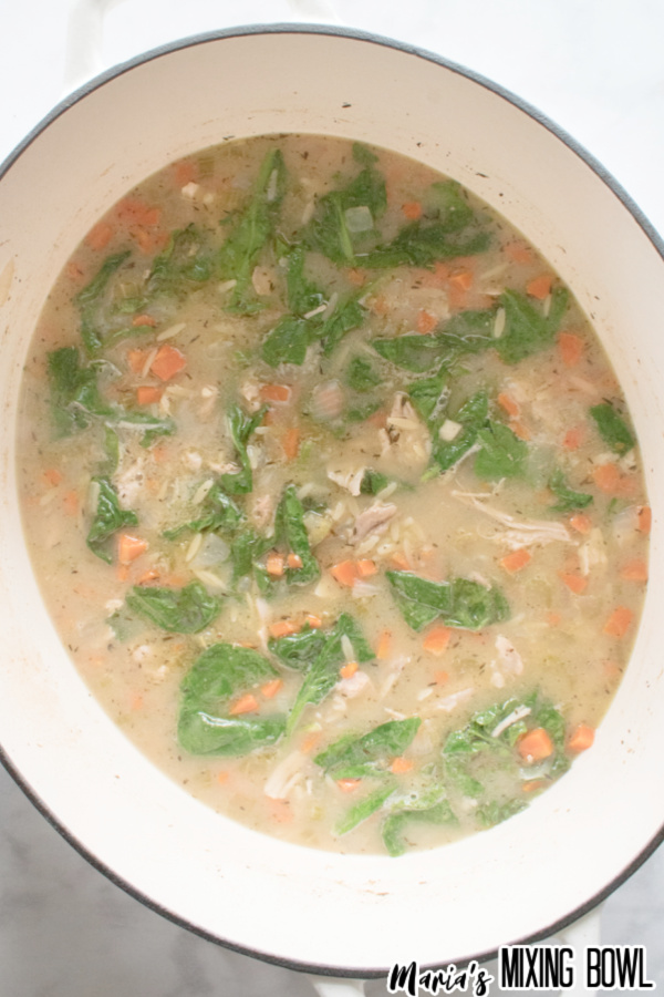 finished easy lemon chicken orzo soup in white pot